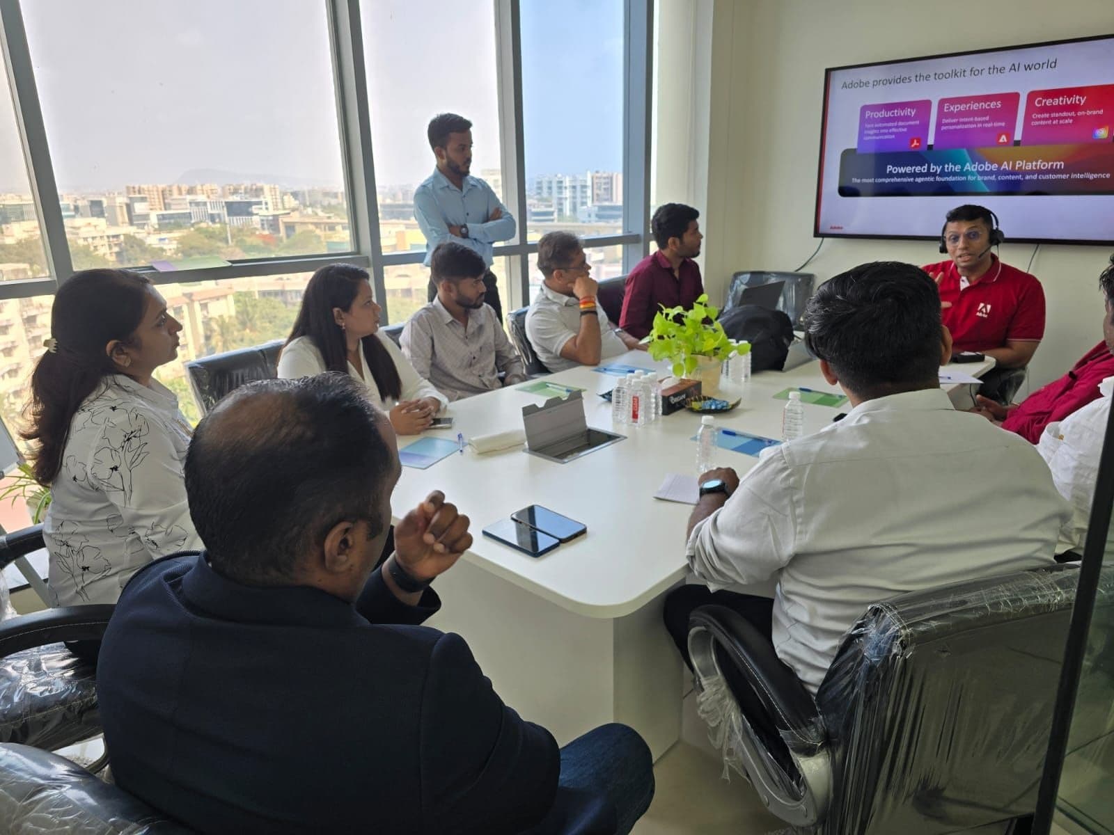 Adobe AI Platform briefing session in Algoritham boardroom — attendees viewing presentation